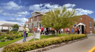 people entering the landmark gallery building in Henning, Minnesota