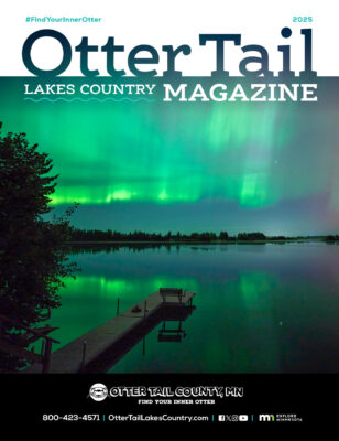 Cover image of magazine showing lake with northern lights in the background